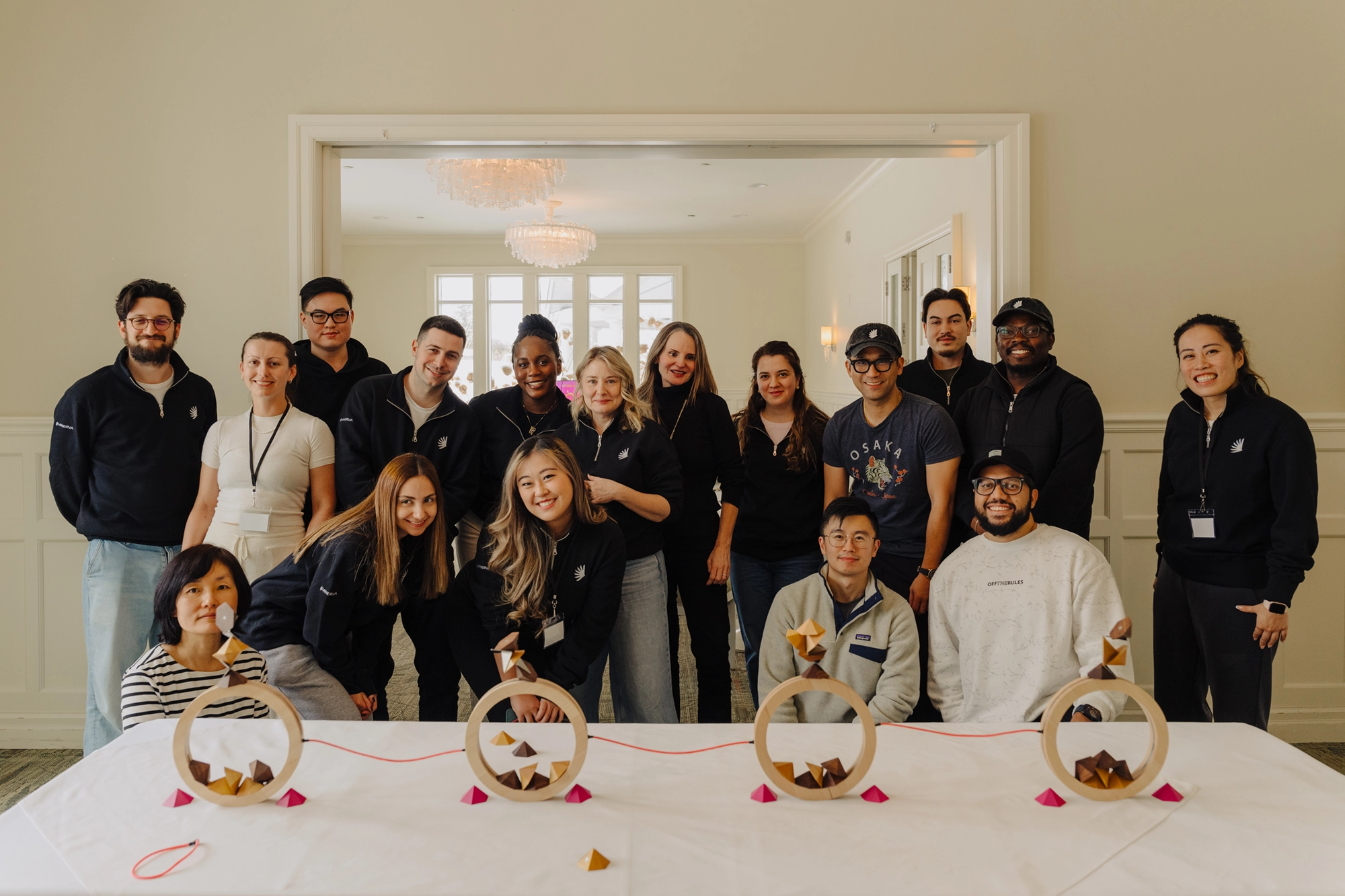 Minerva's team smiling for a group photo